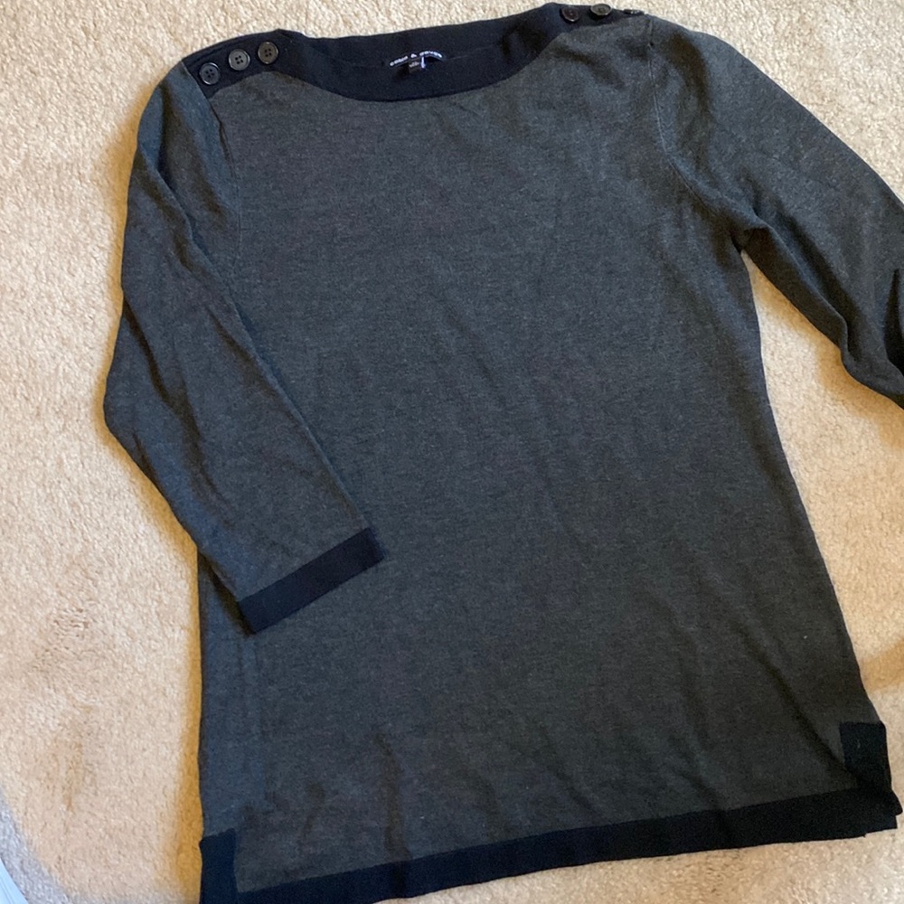 Gray with black trim, button shoulder sweater.